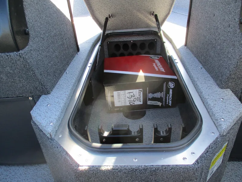 Slide: The Image of 2025 Lund 1875 Fisherman Sport storage compartment with Mercury box inside. - 13
