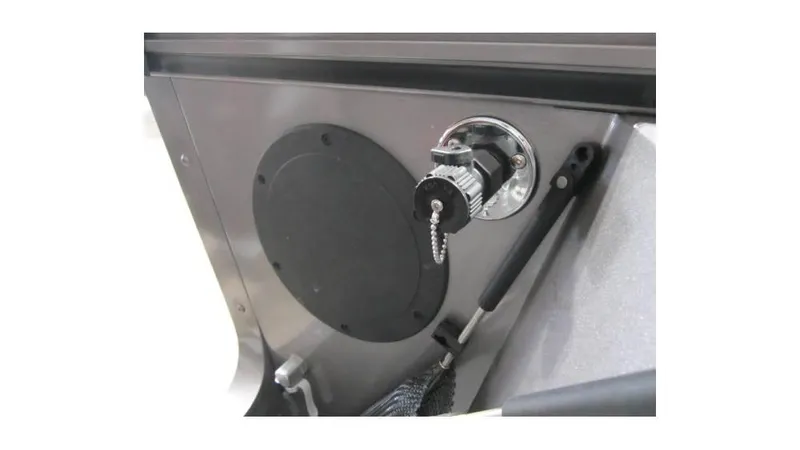 Slide: The Image of 2025 Lund 1875 Fisherman Sport boat interior detail with lock and handle. - 16