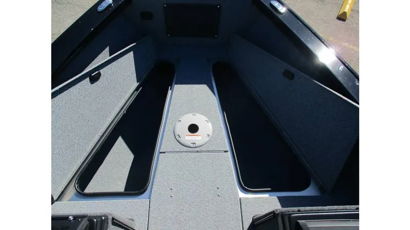 Slide: The Image of 2025 Lund 1875 Fisherman Sport boat interior with open storage compartments. - 5