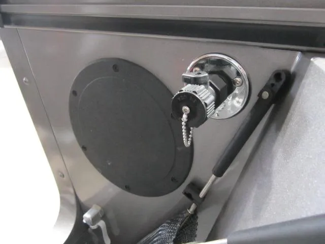 Slide: The Image of 2025 Lund 1875 Fisherman Sport boat interior detail with ignition switch and panel. - 9