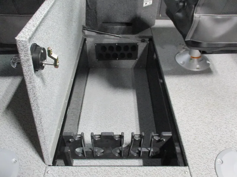 Slide: The Image of 2025 Lund Fisherman 1875 boat interior storage compartment with open lid and seating. - 12