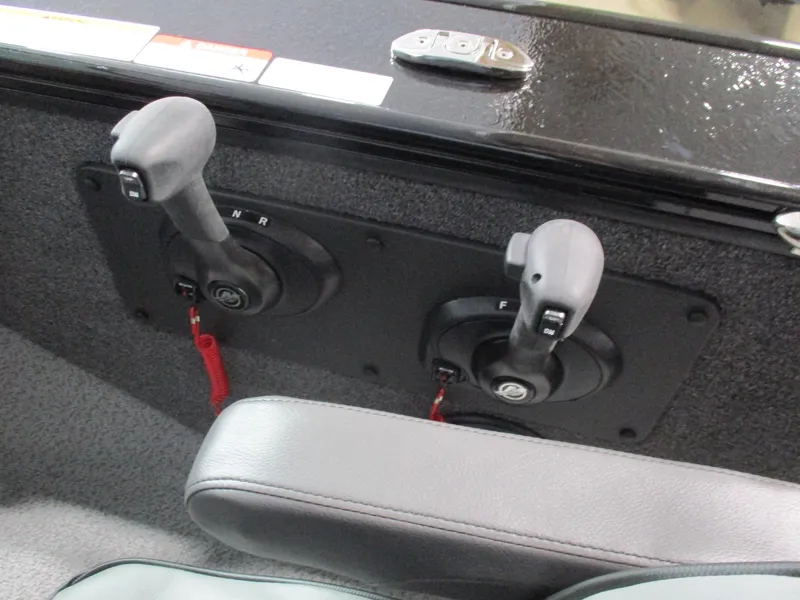 Slide: The Image of Dual throttle controls on 2025 Lund Fisherman 1875 boat dashboard. - 4