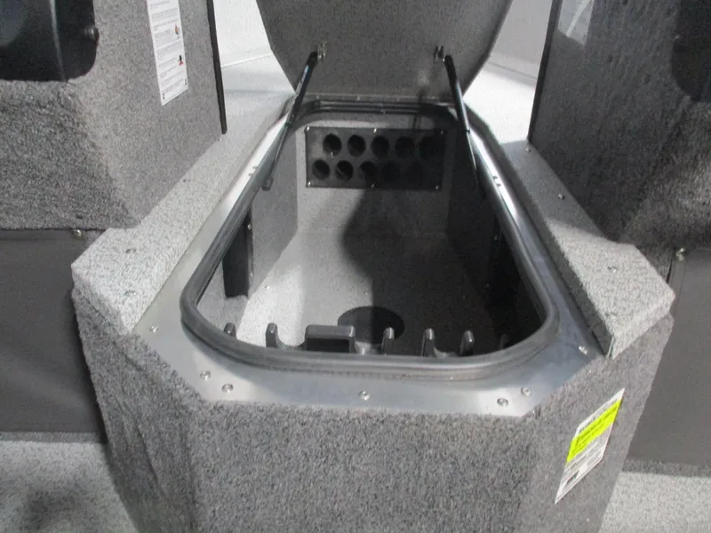 Slide: The Image of 2025 Lund Fisherman 1875 boat storage compartment with open lid, showcasing interior space. - 6