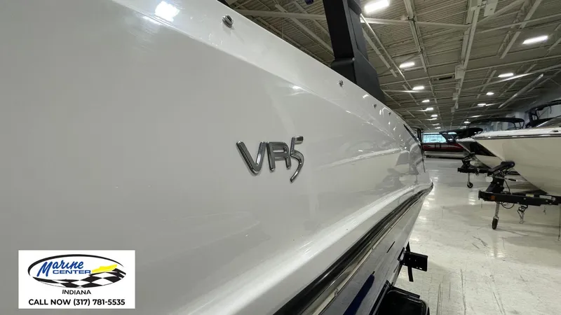 Slide: The Image of 2019 Bayliner VR 5 boat displayed indoors at Marine Center, Indiana. - 12
