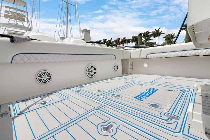 Slide: The Image of 2004 Intrepid 377 Walkaround boat deck with custom flooring and speaker system. - 10
