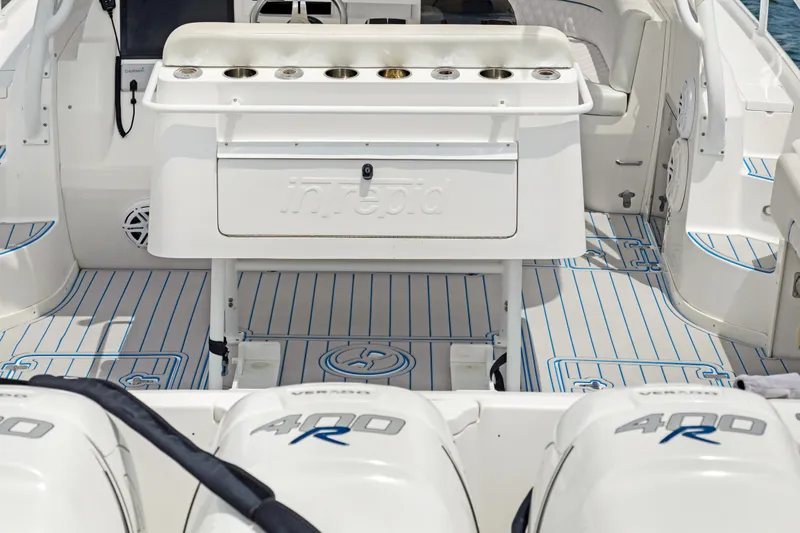 Slide: The Image of 2004 Intrepid 377 Walkaround boat with triple 400R engines and spacious deck layout. - 15