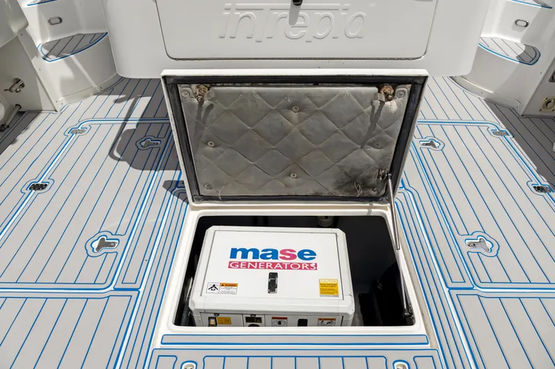 Slide: The Image of 2004 Intrepid 377 Walkaround with Mase generator in open hatch. - 17