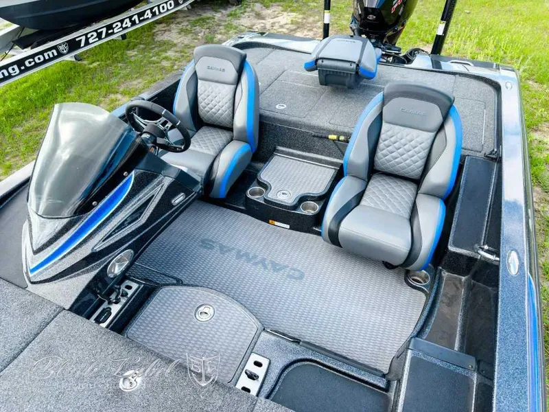 Slide: The Image of 2023 Caymas Bass CX 20 Pro boat deck with storage compartments and motor. - 13