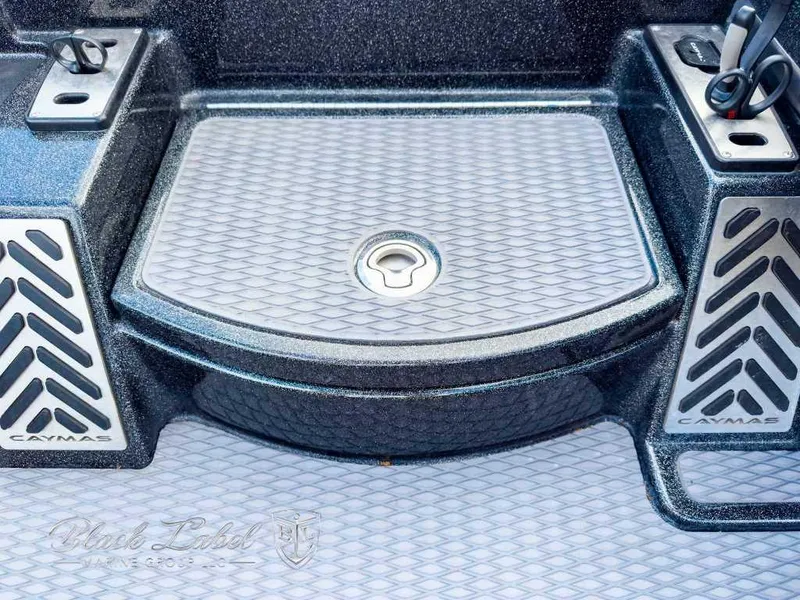 Slide: The Image of 2023 Caymas Bass CX 20 Pro boat dashboard with Lowrance display and steering wheel. - 16