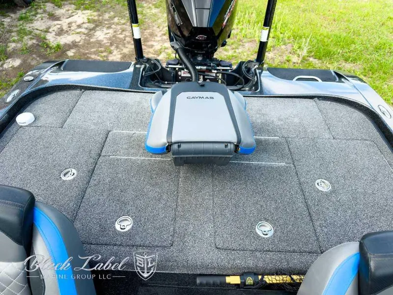 Slide: The Image of 2023 Caymas Bass CX 20 Pro boat interior with luxury seating and steering wheel. - 20