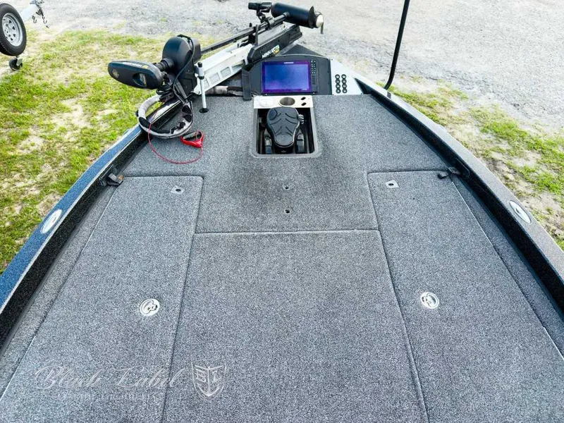Slide: The Image of 2023 Caymas Bass CX 20 Pro boat interior with storage compartment open. - 9