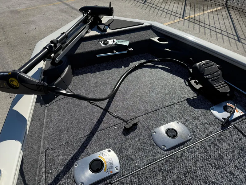 Slide: The Image of 2025 Tracker Pro Team 175 boat deck with trolling motor and foot pedal controls. - 11