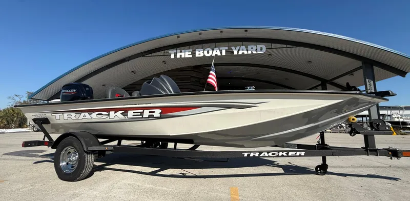 Slide: The Image of 2025 Tracker Pro Team 175 boat at The Boat Yard, featuring sleek design and trailer. - 12
