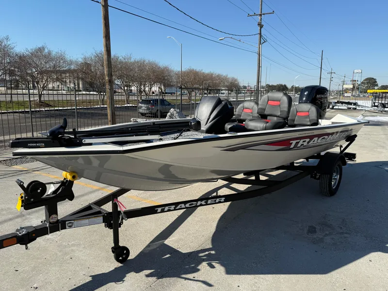 Slide: The Image of 2025 Tracker Pro Team 175 boat on trailer, parked outdoors. - 5