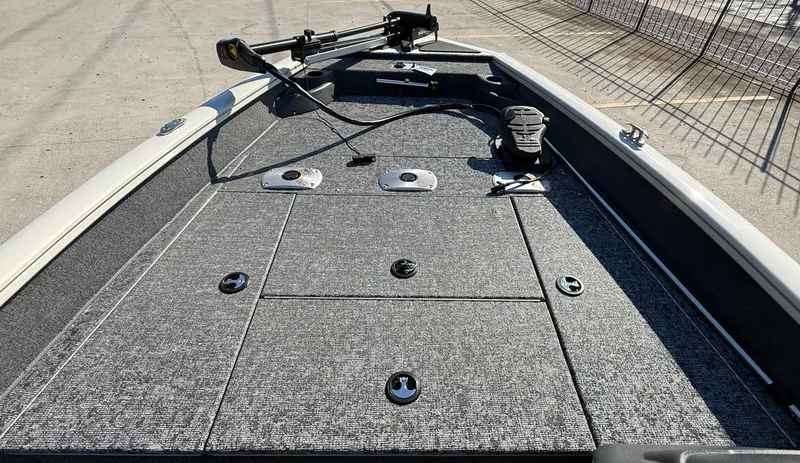 Slide: The Image of 2025 Tracker Pro Team 175 boat deck with storage compartments and trolling motor. - 6