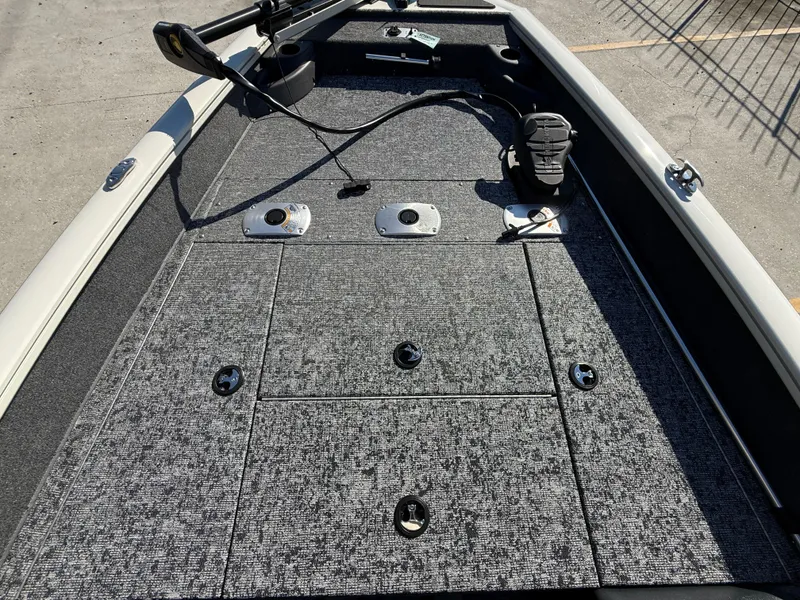 Slide: The Image of 2025 Tracker Pro Team 175 boat deck with storage compartments and fishing equipment. - 7