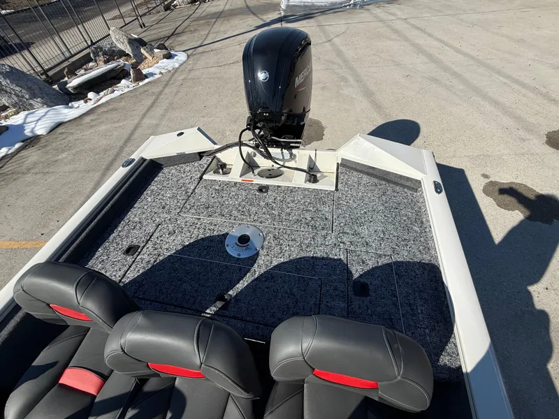 Slide: The Image of 2025 Tracker Pro Team 175 boat with motor, gray deck, and black seats. - 8