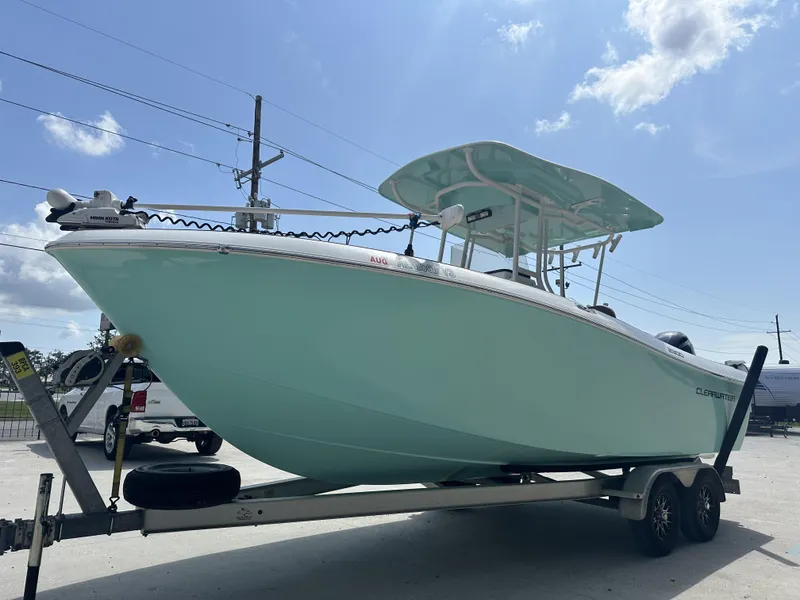 Slide: The Image of 2019 Clearwater 2300 Center Console boat on trailer under clear sky. - 10