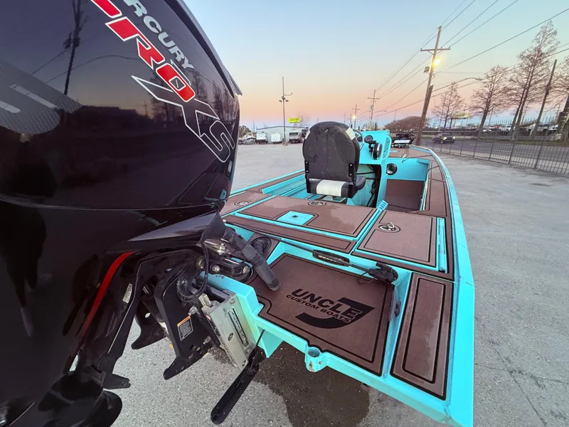 Slide: The Image of 2022 Custom Uncle J 19 Bay Center Console Aluminum boat with Mercury Pro motor at sunset. - 13