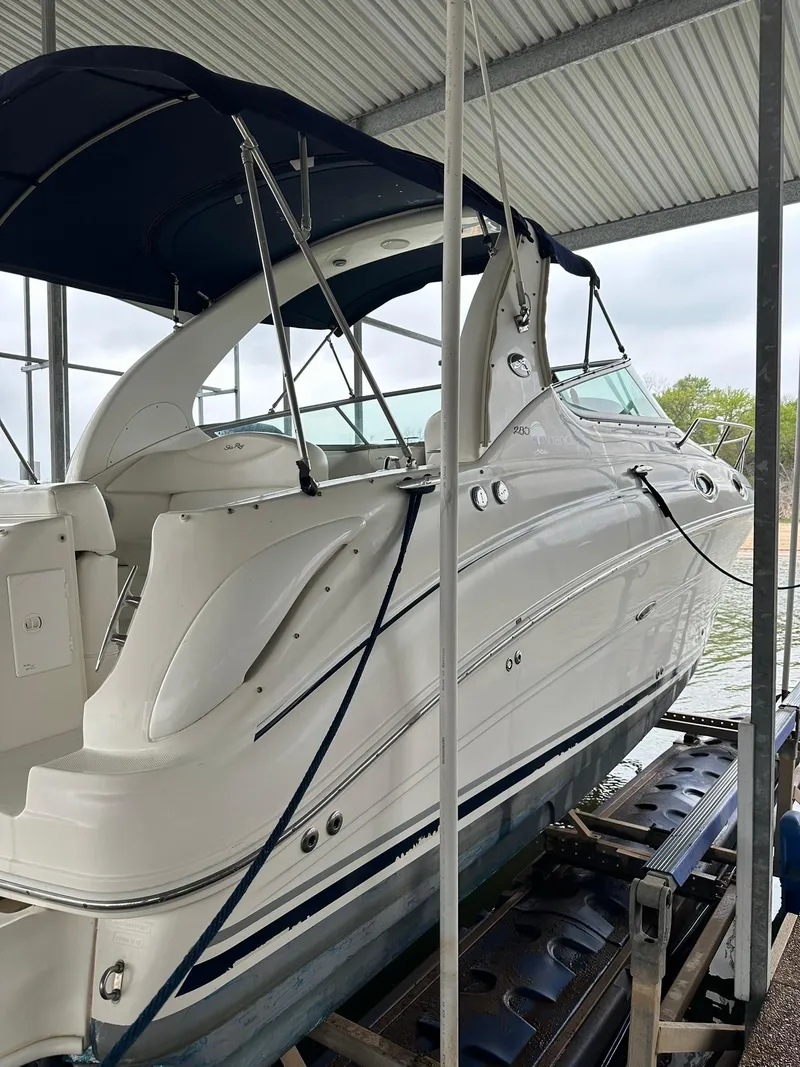 Slide: The Image of 2007 Sea Ray 280 Sundancer boat docked under a covered marina. - 18