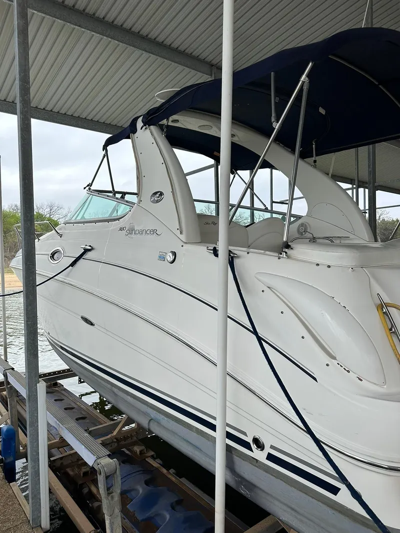 Slide: The Image of 2007 Sea Ray 280 Sundancer boat docked under a covered marina. - 20