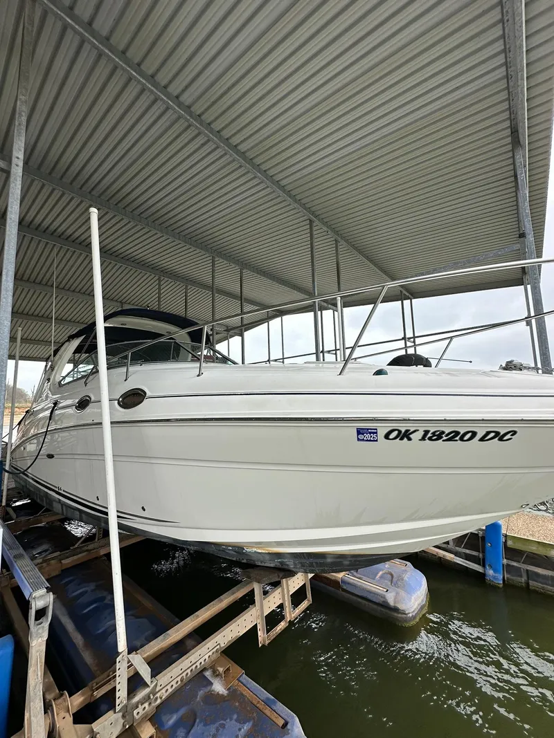 Slide: The Image of 2007 Sea Ray 280 Sundancer docked under a metal canopy. - 4