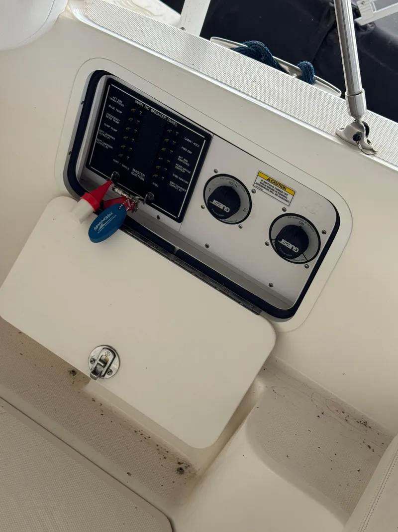 Slide: The Image of Control panel of a 2007 Sea Ray 280 Sundancer boat with gauges and switches. - 8