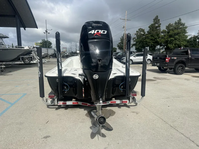 Slide: The Image of 2012 Yellowfin 24 Bay boat with powerful 400R engine, parked on a trailer. - 14