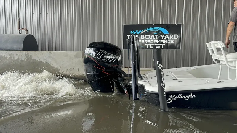 Slide: The Image of 2012 Yellowfin 24 Bay boat undergoing performance test in water. - 15