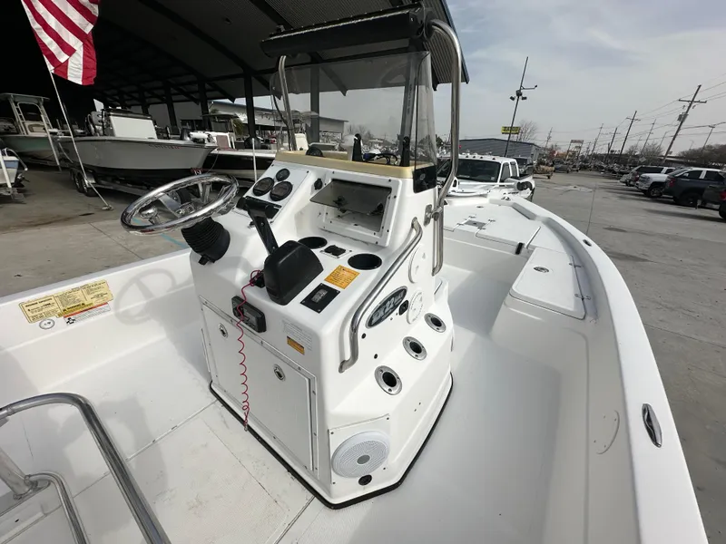 Slide: The Image of 2006 Skeeter ZX 22 Bay boat with steering console and controls, docked outdoors. - 10