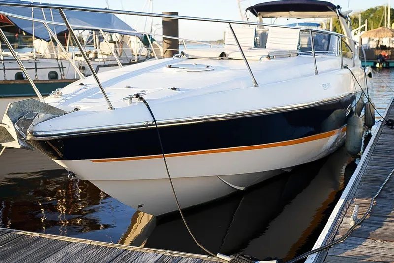 Slide: The Image of Sunseeker Superhawk 48 Mk II, 2000 model, docked at marina, sleek design, luxury motor yacht. - 1