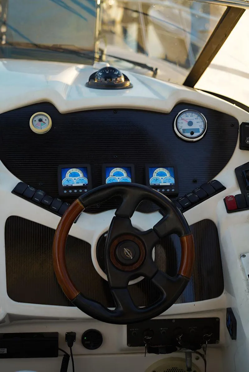 Slide: The Image of Steering wheel and dashboard of 2000 Sunseeker Superhawk 48 Mk II yacht. - 11