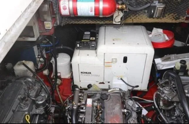 Slide: The Image of Engine room of 2000 Sunseeker Superhawk 48 Mk II with Kohler generator and fire extinguisher. - 17