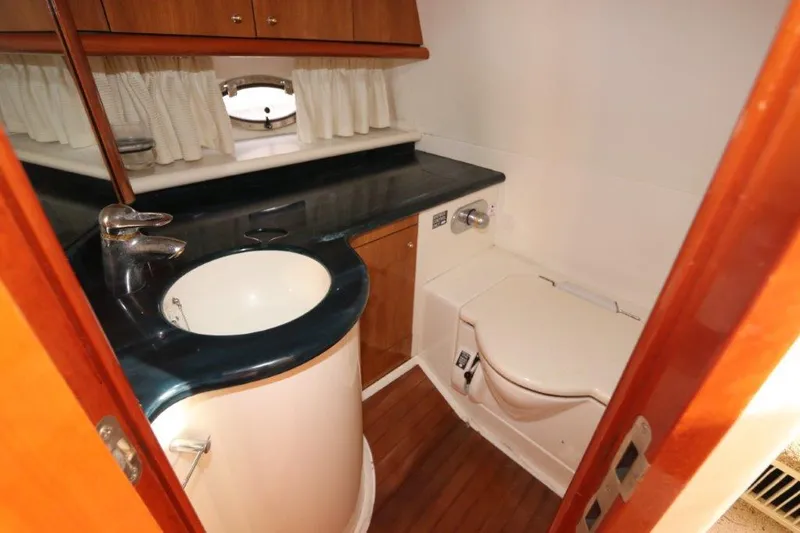 Slide: The Image of Bathroom interior of 2000 Sunseeker Superhawk 48 Mk II yacht, featuring sink and toilet. - 24