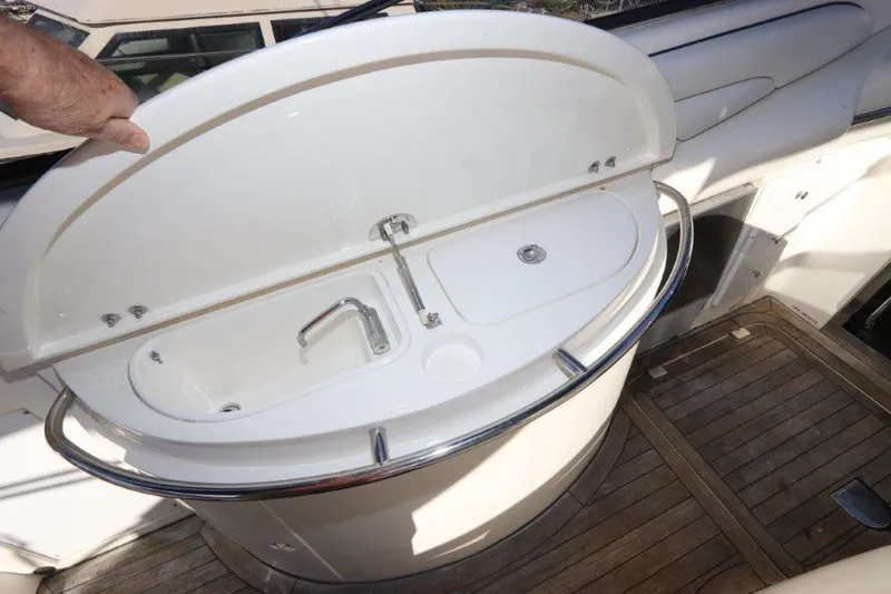 Slide: The Image of Sunseeker Superhawk 48 Mk II 2000 yacht sink with wooden deck and open cover. - 25