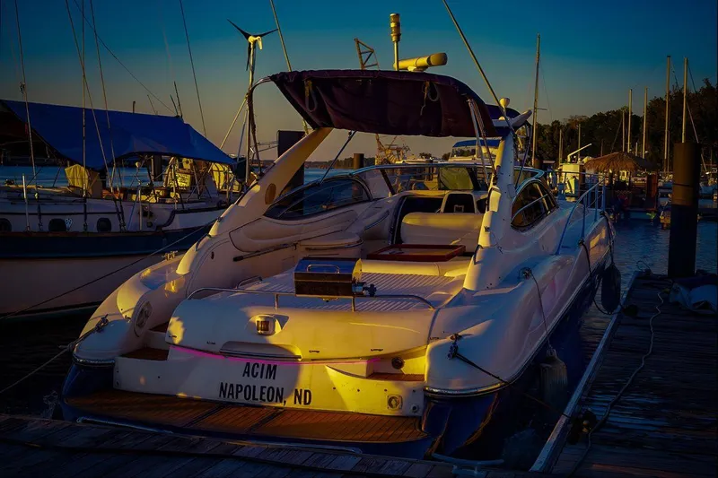 Slide: The Image of Sunseeker Superhawk 48 Mk II yacht docked at sunset, 2000 model. - 3