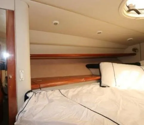 Slide: The Image of Interior cabin of 2000 Sunseeker Superhawk 48 Mk II yacht, featuring a cozy bed. - 6