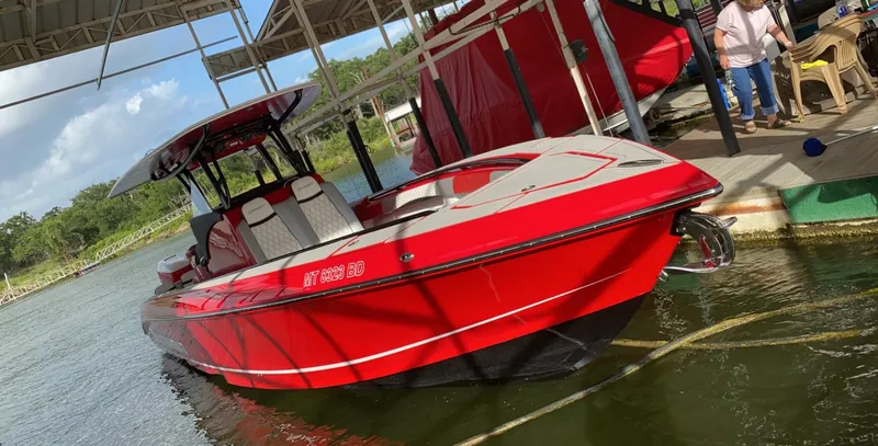 Slide: The Image of Red 2019 Statement 350 Open boat docked at marina under a canopy. - 8