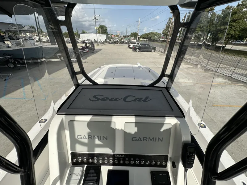 Slide: The Image of 2023 Sea Cat 262 Hybrid boat dashboard with Garmin displays, located in Marrero, New Orleans. - 10