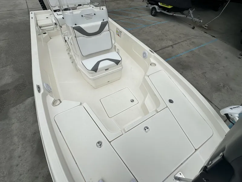 Slide: The Image of 2023 Skeeter SX230 boat interior with seating and storage compartments. - 22