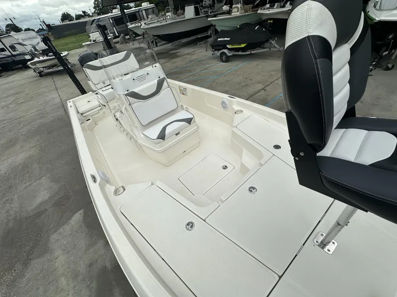 Slide: The Image of 2023 Skeeter SX230 boat interior with sleek seating and storage compartments. - 5