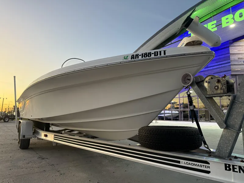 Slide: The Image of 2006 Sea Fox 225 Bay Fisher boat on trailer at sunset, side view. - 10