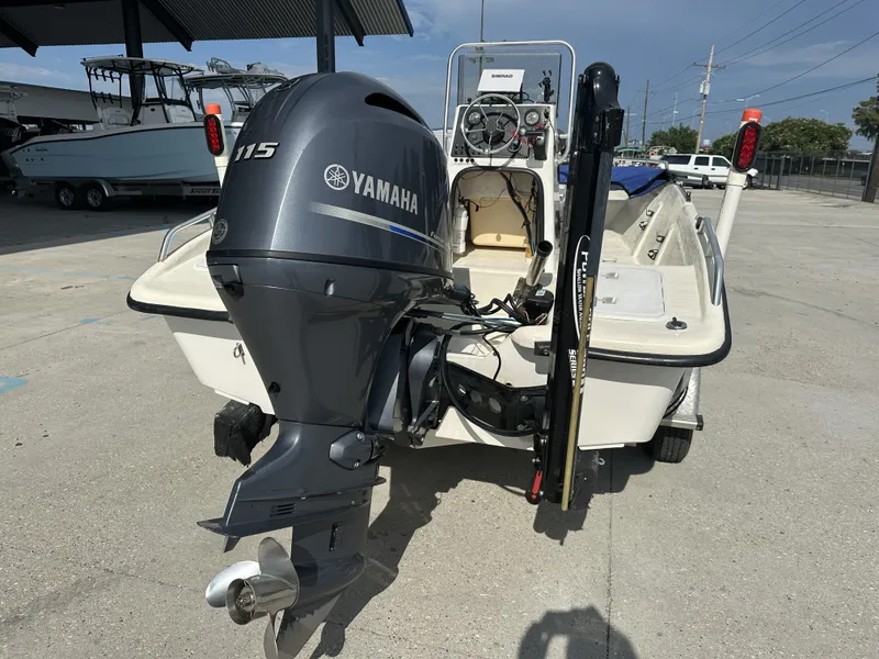 Slide: The Image of 2004 Sea Chaser 175 CC boat with Yamaha 115 outboard motor, parked outdoors. - 3