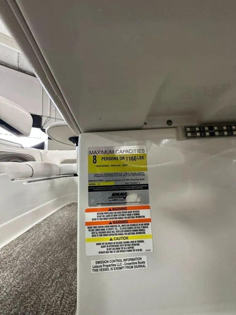 Slide: The Image of 2012 Crownline E1 boat capacity label, maximum 8 persons or 1160 lbs. - 12