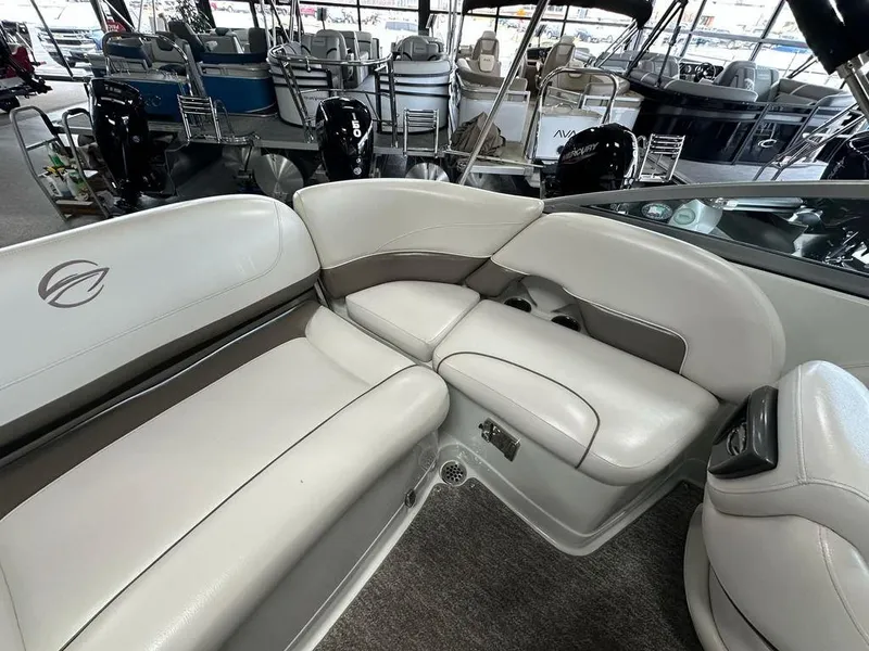 Slide: The Image of 2012 Crownline E1 boat interior with beige seating and modern design. - 13