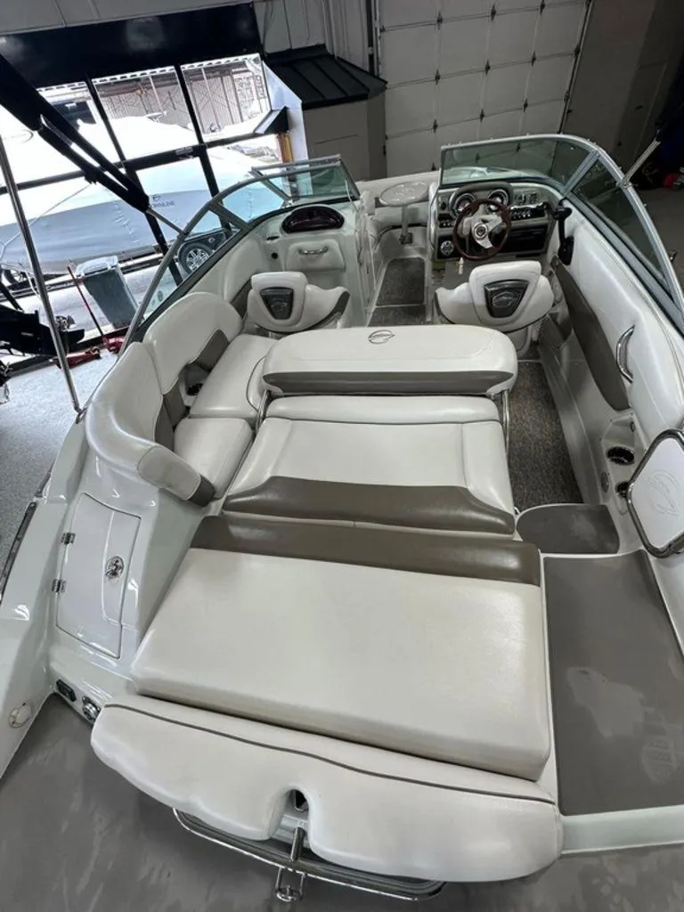 Slide: The Image of 2012 Crownline E1 boat interior with spacious seating and modern dashboard. - 16