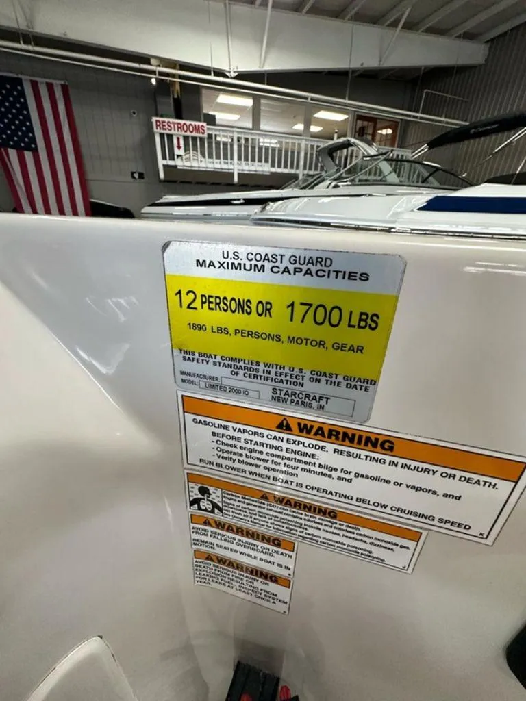 Slide: The Image of Boat capacity label for Starcraft 2000, 2011 model, showing U.S. Coast Guard safety limits. - 12