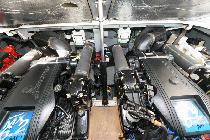 Slide: The Image of Engine room of a 2001 Sea Ray 340 Sundancer with dual Mercury engines. - 14
