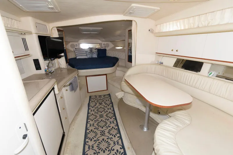 Slide: The Image of Interior of 2001 Sea Ray 340 Sundancer yacht with cozy seating and modern amenities. - 8