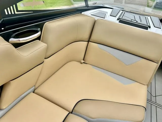 Slide: The Image of 2019 Moomba Makai™ boat interior with beige and gray seating. - 14